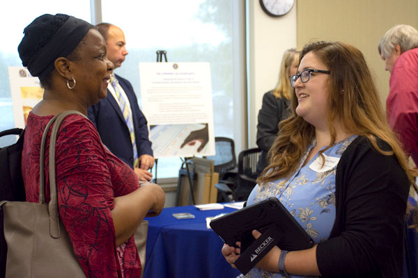Master's in Accounting student meeting with a recruiter at an employer event