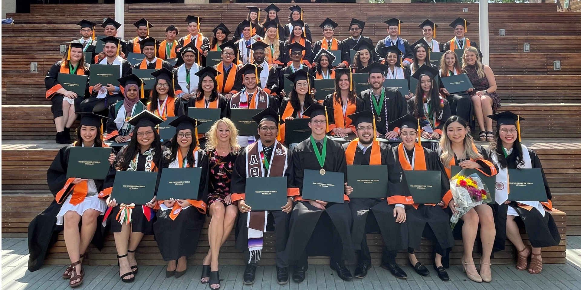 New alumni from the Professional Program in Accounting gather after the ceremony to celebrate on the mall. The program prepares students to pass the CPA exam and helps them secure public accounting internships and full-time jobs upon graduation.